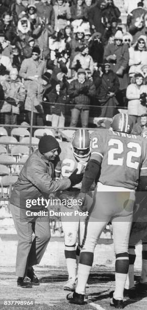 Denver Broncos This Kind of Results Coach John Ralston of Denver congratulates Greer in the end zone after his punt return as running back Fran Lynch...
