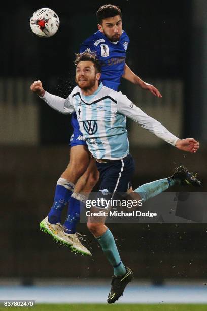 Kristian Konstantinidis of South Melbourne heads the ball over Alex Morgan of Sorrento during the FFA Cup round of 16 match between between South...