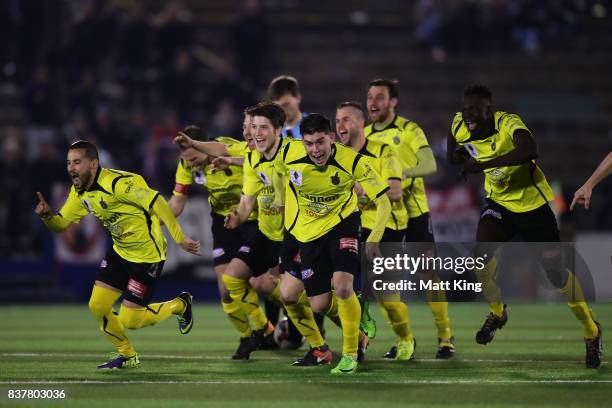 Alexander Schiavo of Heidleberg United and team mates celebrate victory after the penalty shoot out during the FFA Cup round of 16 match between...