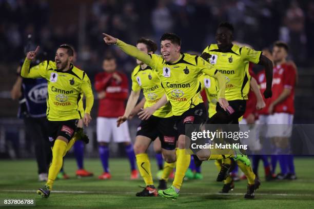 Alexander Schiavo of Heidleberg United and team mates celebrate victory after the penalty shoot out during the FFA Cup round of 16 match between...