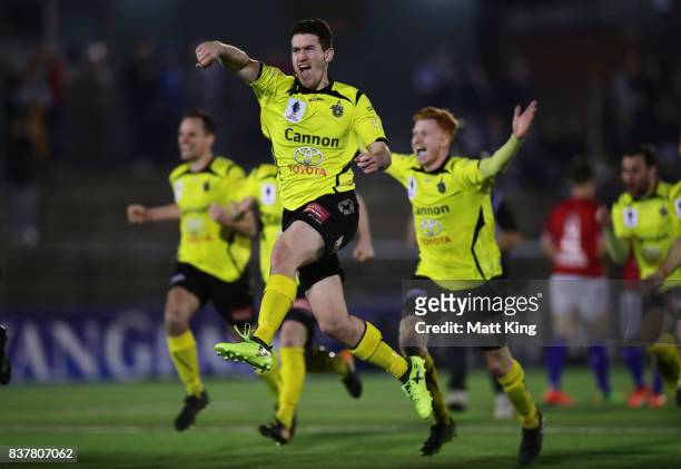 Joshua Wilkins of Heidleberg United and team mates celebrate victory after the penalty shoot out during the FFA Cup round of 16 match between Sydney...