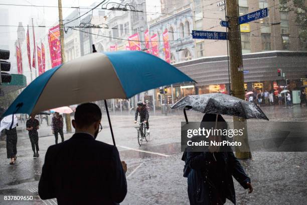 Melbourne, Australia, 21 march 2017. A view from the street of the central business district as rain is heavily falling. Melbourne is ranked as the...