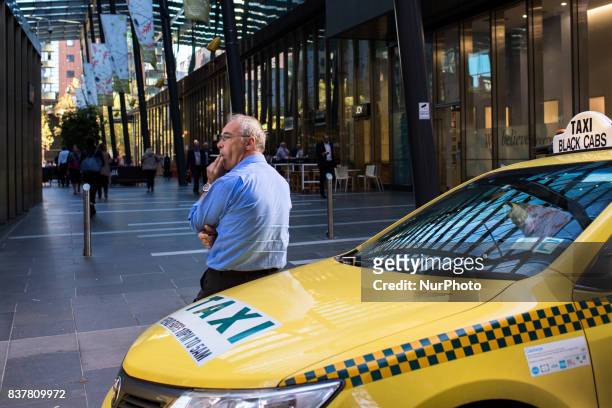 Melbourne, Australia, 27 march 2017. A taxi men smokes a cigaret in a street of the central business district. Melbourne is ranked as the worlds most...