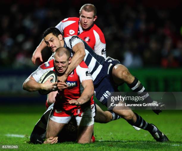 Mike Tindall of Gloucester is tackled by Neil Brew of Bristol to score a try during the Guinness Premiership Match between Gloucester Rugby and...