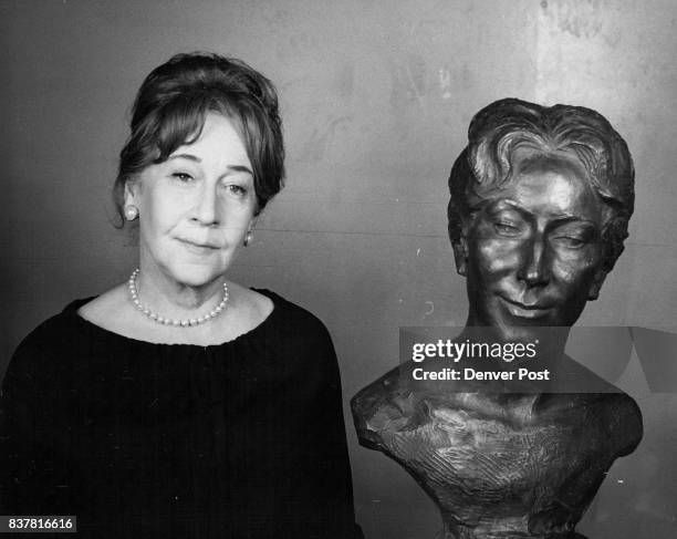 Prize for The Post's Gretchen Gretchen Weber, Denver Post fashion editor, poses with a bust of her, sculptured by Anthony Cipriano and cast in...