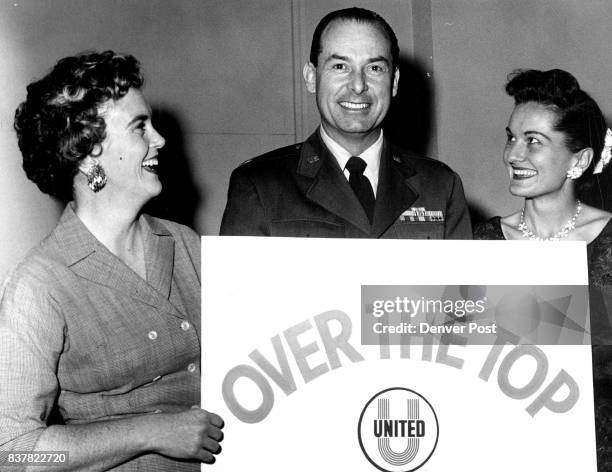 The Sign Tells Their Tale Three representatives of subdivisions which went over the top or their assigned goals in the Mile High Unitea Fund...