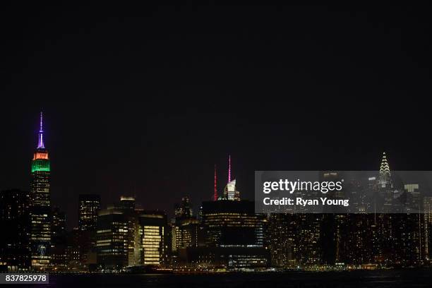 The Empire State Building is lit up in FedEx colors to commemorate the beginning of THE NORTHERN TRUST and the FedEx Cup Playoffs on August 22, 2017...