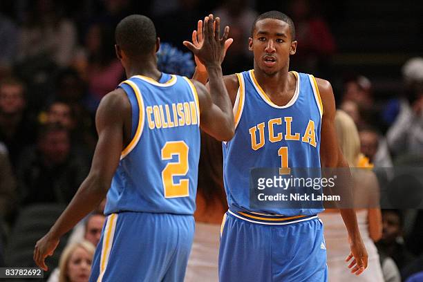 Malcolm Lee of the UCLA Bruins celebrates a basket with teammate Darren Collison against the Southern Illinois Salukis on November 21, 2008 at...