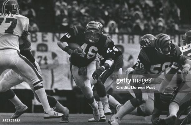 Bengals' running back Pete Johnson barrels through a gaping hole as Broncos' Greg Boyd and Tom Jackson are shoved aside. Credit: The Denver Post