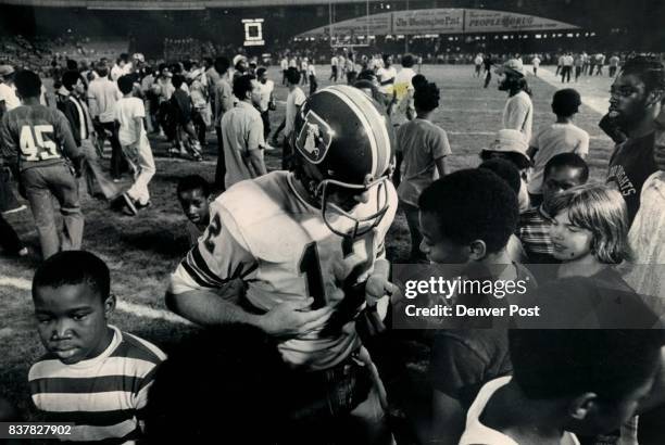 Charley Johnson Gets Touched For Slight Loss After Exhibition Game Young Washington fan puts the touch on Denver quarterback to get souvenir wrist...