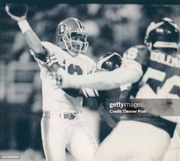 Special To The Denver Post-Viking Ken Clarke Pressures Gary Kubiak In The 4th Quarter. Chris Doleman Moves In for the help Photo By Karl Gehring1990...