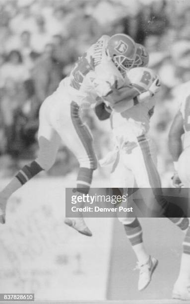 Special to the Denver Post -- Broncos Tyrone Braxton and Steve Atwater high five after a third of fumble recovery in their victory over Kansas City...