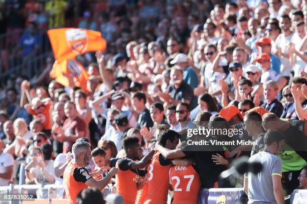 Denis Bouanga of Lorient celebrates with teammates after scoring the first goal during the French League Cup match between FC Lorient and RC Lens at...