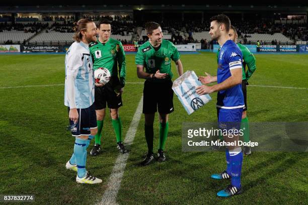 Captains Daryl Platten of Sorrento and Brad Norton of South Melbourne greet each other during the FFA Cup round of 16 match between between South...