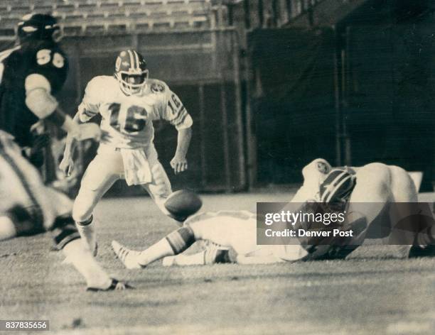Denver Broncos A counting exercise in fumble futility Bronco quarterback John Hufnagel watches ball fall to ground after exchange to running back...