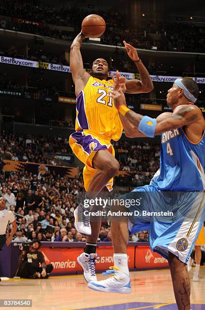 Josh Powell of the Los Angeles Lakers goes up for a shot against Kenyon Martin of the Denver Nuggets at Staples Center on November 21, 2008 in Los...