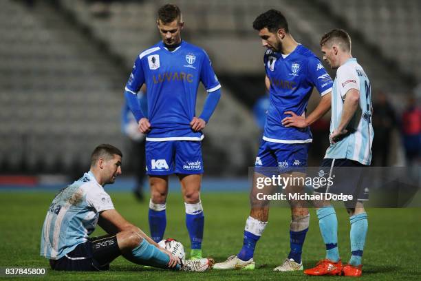 Sean Canham of Sorrento waits to be carried off after receiving a red card during the FFA Cup round of 16 match between between South Melbourne FC...