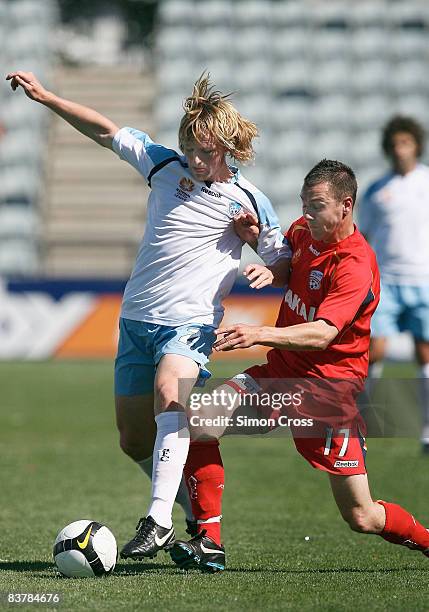 Rhyan Grant of Sydney tries to get past Shane Tobias of United during the round nine National Youth League match between Adelaide United and Sydney...