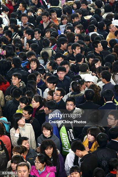 Graduating university students crowd a job fair on November 22, 2008 in Changchun of Jilin Province, China. Over 60,000 applicants visited the fair...