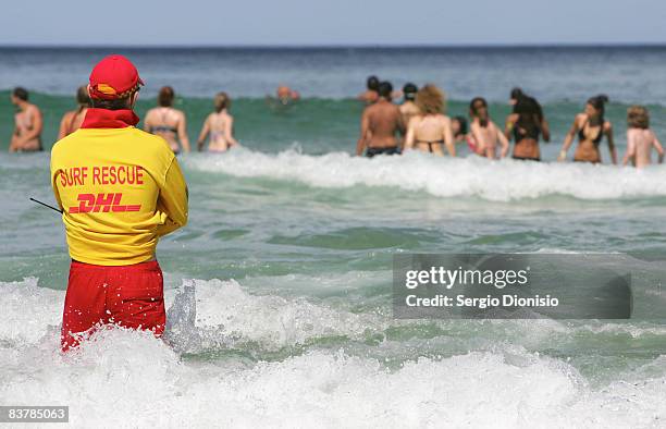 Life guard supervises graduating year 12 students swim ahead of this weeks Schoolies celebrations in Surfers Paradise on November 22, 2008 on the...