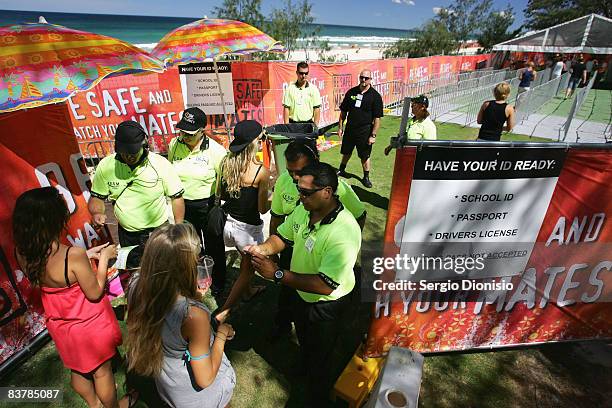 Graduating year 12 students clear an Identification check point as they register for this weeks Schoolies celebrations in Surfers Paradise on...