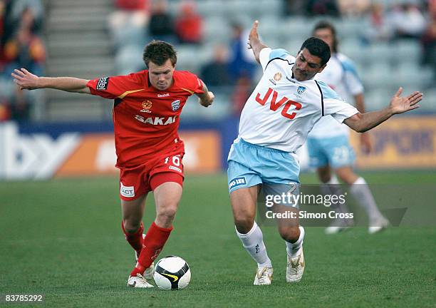 Daniel Mullen of United competes with John Aloisi of Sydney during the round 12 A-League match between Adelaide United and Sydney FC at Hindmarsh...