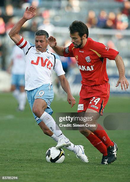 Steve Corcia of Sydney and Paul Reid of United compete for the ball during the round 12 A-League match between Adelaide United and Sydney FC at...