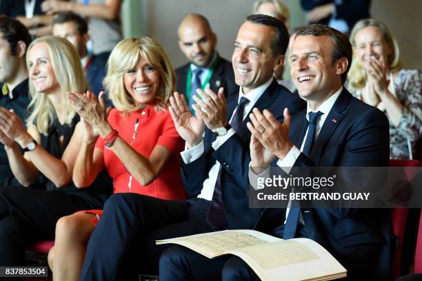 French President Emmanuel Macron, Austrian Chancellor Christian Kern applaud with their wifes Brigitte Macron and Eveline Steinberger-Kern during a...