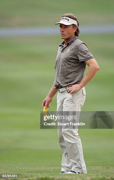 Bernhard Langer of Germany holds a banana skin during the third round of the UBS Hong Kong Open at the Hong Kong Golf Club on November 22, 2008 in...