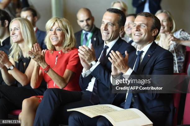 French President Emmanuel Macron, Austrian Chancellor Christian Kern applaud with their wifes Brigitte Macron and Eveline Steinberger-Kern during a...