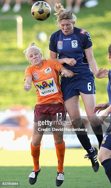 Tameka Butt of the Roar and Maika Ruyter-Hooley of Victory compete for a header during the round five W-League match between the Queensland Roar and...