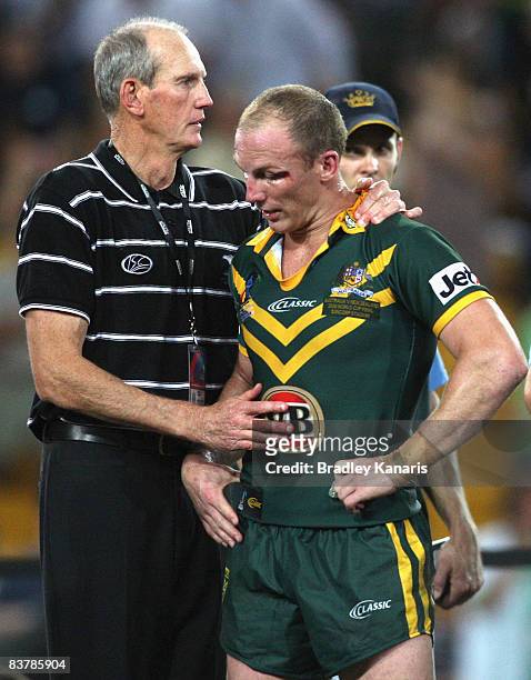 New Zealand Assistant coach Wayne Bennett consoles Darren Lockyer of the Kangaroos after the 2008 Rugby League World Cup Final match between the...