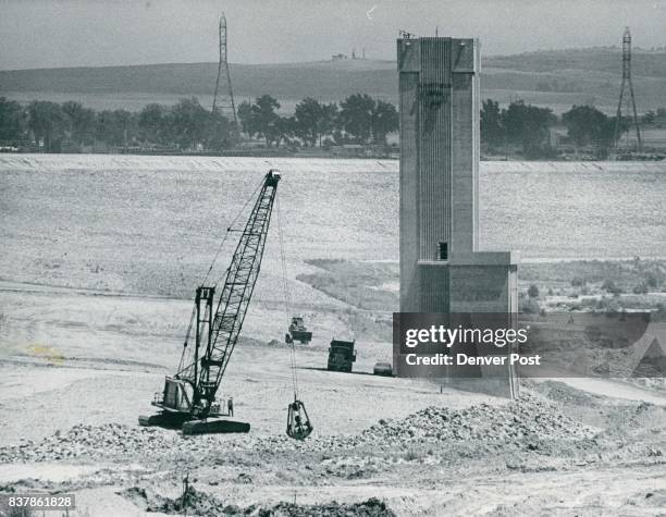 Chatfield Progress Continues Chatfield Reservoir's intake tower, above, which takes water in at its base and passes it through pipes under dam,...