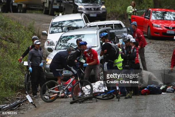 Formula One driver Mark Webber receives medical attention at the scene after a collision with a car during day four of the Mark Webber Pure Tasmania...
