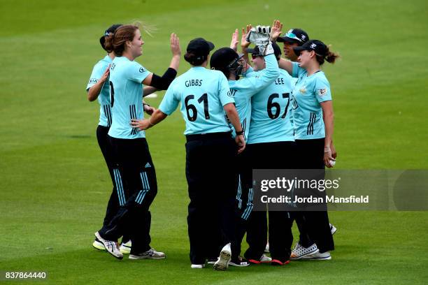 Natalie Sciver of Surrey celebrates with her teammates after dismissing Stafanie Taylor of Western Storm during the Kia Super League match between...