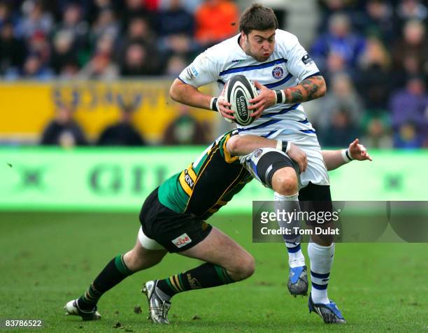 Matt Banaham of Bath Rugby is tackled by James Downey of Northampton Saints during the Guinness Premiership match between Northampton Saints and Bath...