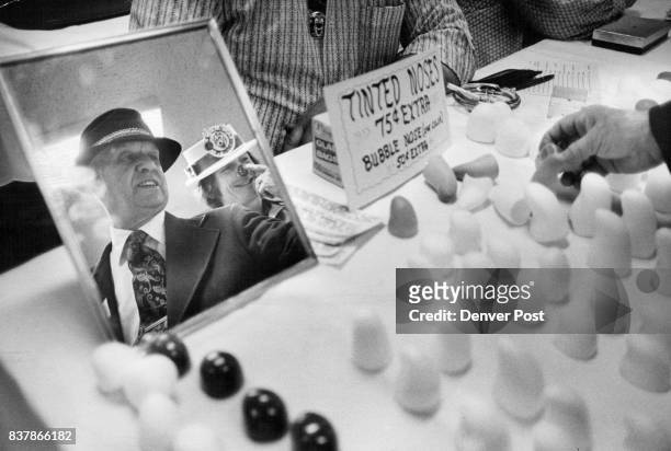 Jack Mark, known as Benzine Farley, clowns around, right, at the national clown conversion at the Albany Hotel. An assortment of noses, left, was on...