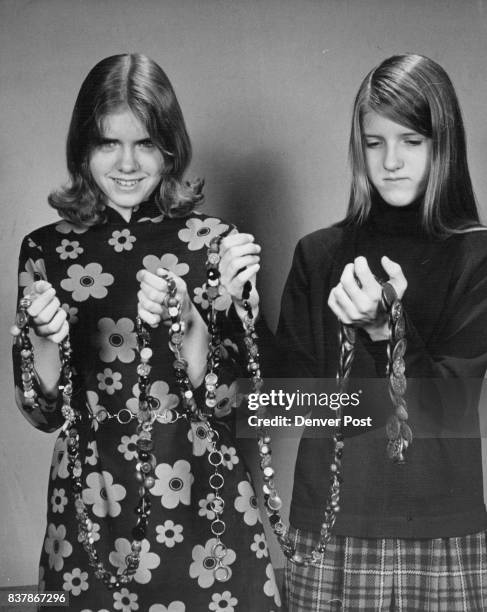 To R: Elizabeth Telea, Christine Telea Century-Old Charm String Elizabeth, left, and Christine Telea, daughters of Mr. And Mrs. Edward Telea, display...