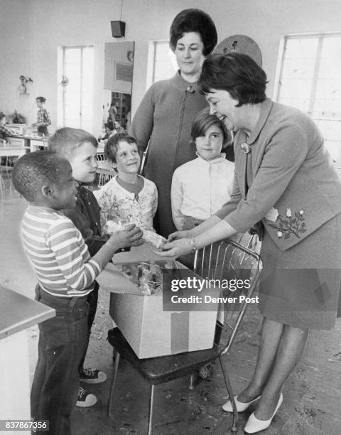 Carih Children Get Candy Mrs. William McNichols, right, distributes candy to, from ft, Louie Hawkins Tucson, Ariz.; Andy Cooks New York City; Lisa...