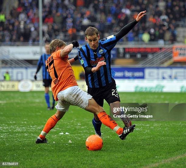 Andreas Mayer of Aalen challenges Soeren Halfar of Paderborn during the 3. Bundesliga match between SC Paderborn and VFR Aalen at the Paragon Arena...