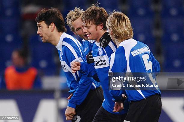 Markus Schuler, Jonas Kamper, Daniel Halfar and Ruediger Kauf of Bielefeld celebrate the second goal for their team during the Bundesliga match...