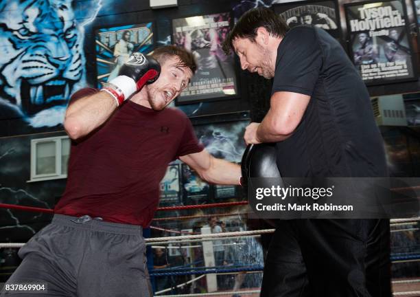 Callum Smith takes part in a training session with his trainer Joe Gallagher at Gallaghers Gym on August 23, 2017 in Bolton, England.