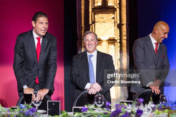 Carlos Hank Gonzalez, chairman of Grupo Financiero Banorte SAB, from left, Jose Antonio Meade, Mexico's finance minister, and Marcos Ramirez Miguel,...