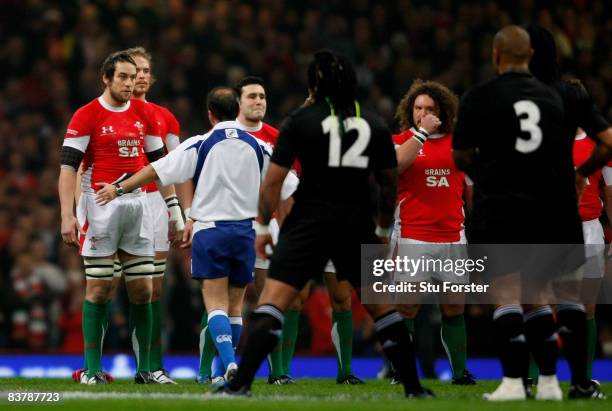 Wales captain Ryan Jones is spoken to by referee Jonathan Kaplan during the Haka before the Invesco Perpetual Series match between Wales and New...