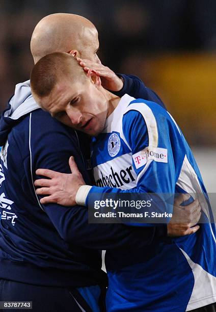 Head coach Michael Frontzeck and Artur Wichniarek of Bielefeld celebrate during the Bundesliga match between Arminia Bielefeld and Bayer Leverkusen...