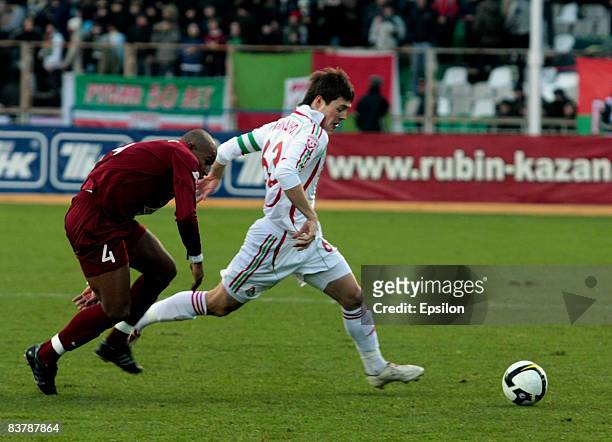 Jefthon of FC Rubin Kazan competes for the ball with Diniyar Bilyaletdinov of FC Lokomotiv Moscow during the Russian Football League Championship...