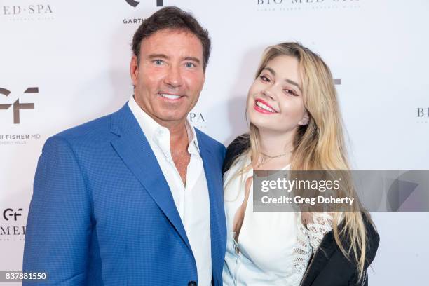 Dr. Garth Fisher and his daughter Sierra Fisher attend the Official Launch Party Of Dr. Garth Fisher's BioMed Spa at Garth Fisher MD on August 22,...