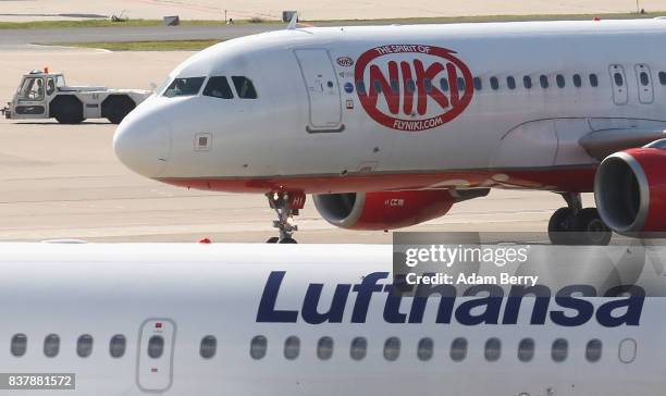 Niki and Lufthansa airplanes are seen on the tarmac at Tegel Airport on August 23, 2017 in Berlin, Germany. Air Berlin's creditors are meeting to...