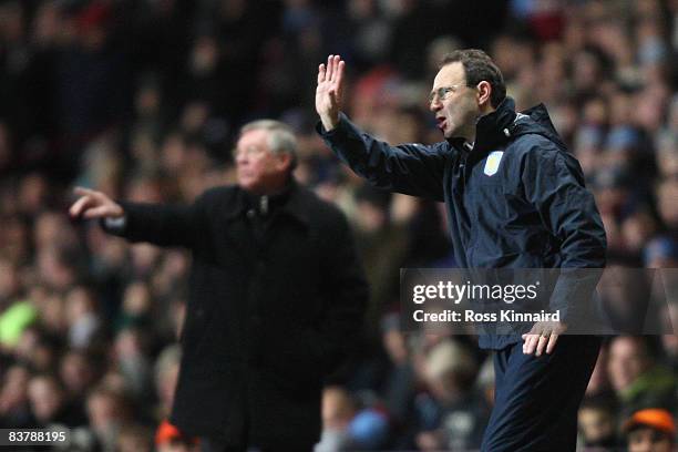 Manchester United Manager Sir Alex Ferguson and Aston Villa Manager Martin O'Neill issue instructions during the Barclays Premier League match...