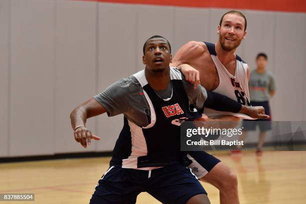 Jonathan Holmes boxes out Alec Brown of the USA AmeriCup Team during a training camp at the University of Houston in Houston, Texas on August 21,...